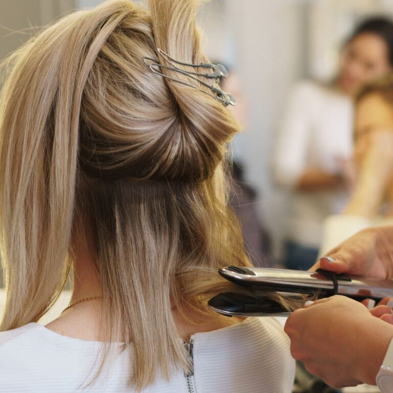 lady having her hair straightened